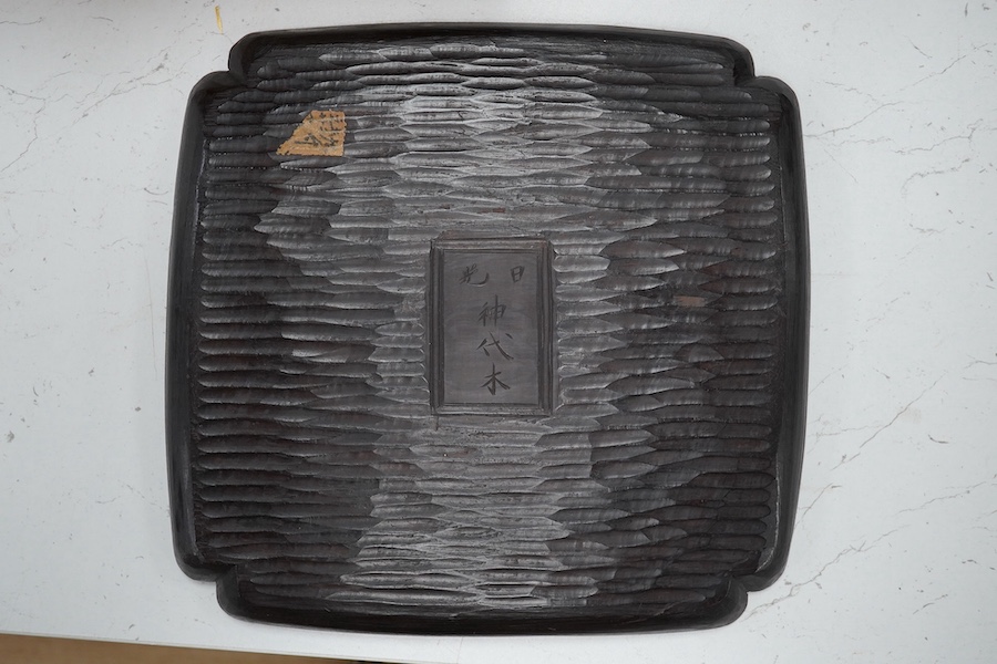 An early 20th century Japanese carved wooden plaque, 26cm x 27cm. Condition - a few chips to edge